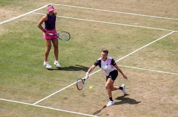 Demi Schuurs of Netherlands stretches to play a forehand while playing with her partner Nicole Melichar of United States in the women's doubles final...