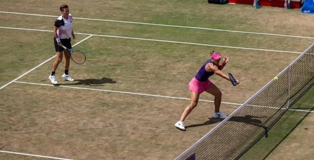 Nicole Melichar of United States stretches to play a forehand while playing with her partner Demi Schuurs of Netherlands in the women's doubles final...