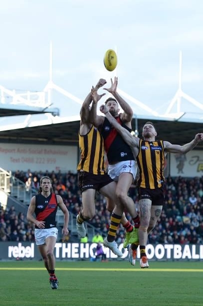 Cale Hooker of the Bombers contests the ball during the round 14 AFL match between the Hawthorn Hawks and the Essendon Bombers at University of...