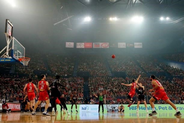 David Barlow of Melbourne United shoots under pressure from Mitchell Norton of the Wildcats during game two of the NBL Grand Final Series between the...