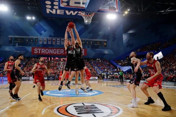 Mitch McCarron and Jock Landale of Melbourne United go for the rebound during game two of the NBL Grand Final Series between the Perth Wildcats and...
