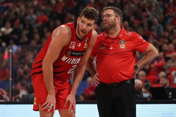 Will Magnay of the Wildcats looks on with Trevor Gleeson, coach of the Wildcats during game two of the NBL Grand Final Series between the Perth...