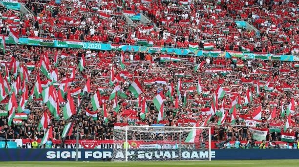 Supporters of Hungary are seen as a 'Sign For An Equal Game' message is displayed on the perimeter boards prior to the UEFA Euro 2020 Championship...