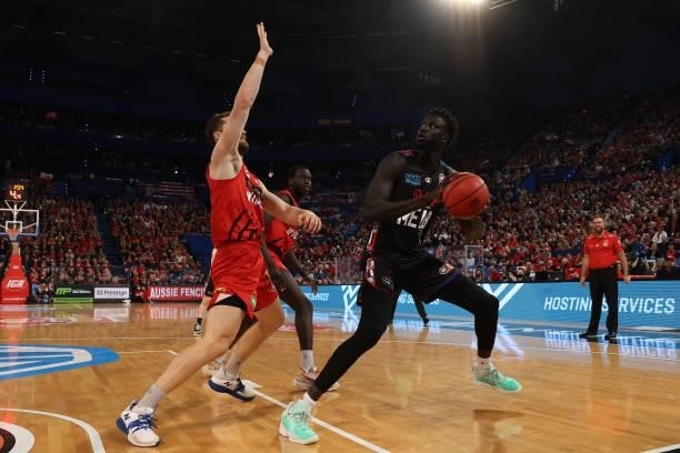 Jo Lual-Acuil of Melbourne United works to the basket against Jarred Bairstow of the Wildcats during game two of the NBL Grand Final Series between...