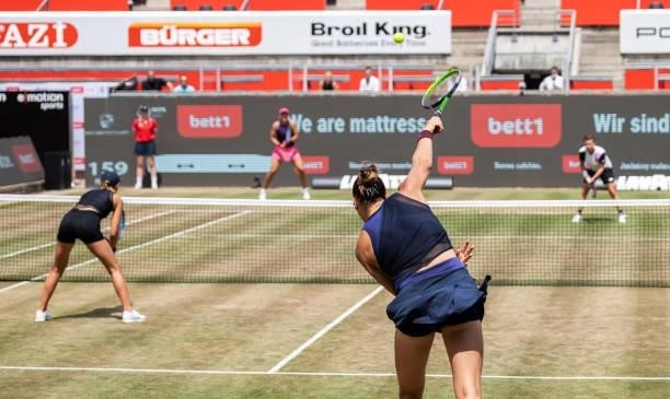 Victoria Azarenka of Belarus serves in the women's doubles final match with her partner Aryna Sabalenka of Belarus against Demi Schuurs of...
