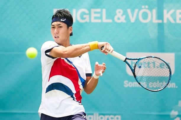 Yosuke Watanuki of Japan plays a forehand shot during his Men's Singles Second Round Qualifying match against Roberto Carballes Baena of Spain on day...