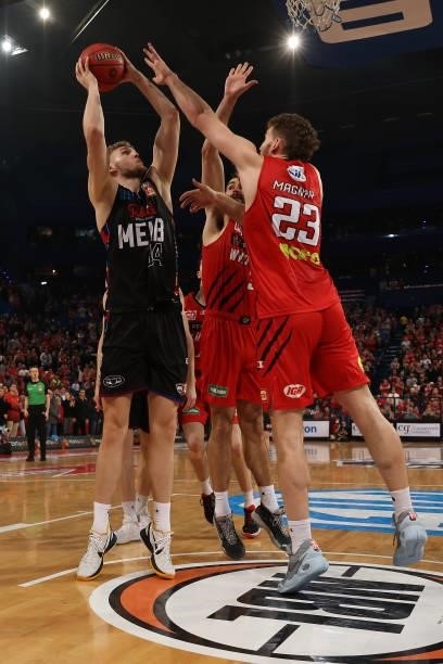 Jock Landale of Melbourne United puts a shot up against Todd Blanchfield and Will Magnay of the Wildcats during game two of the NBL Grand Final...