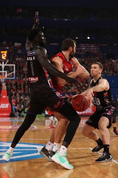 Mitch McCarron of Melbourne United strips the ball from John Mooney of the Wildcats during game two of the NBL Grand Final Series between the Perth...