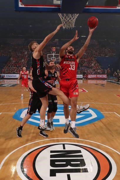John Mooney of the Wildcats goes to the basket against Jock Landale of Melbourne United during game two of the NBL Grand Final Series between the...
