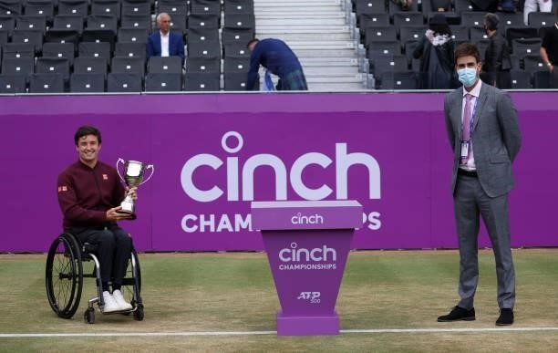 Gordon Reid of Great Britain winner of the wheelchair finals and David Rawlinson President of the LTA during Day 7 of The cinch Championships at The...