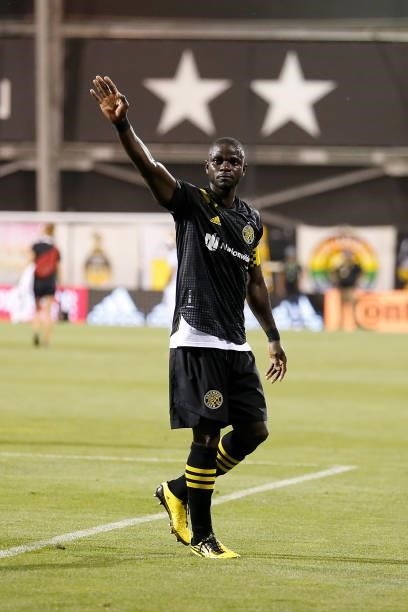 Jonathan Mensah of the Columbus Crew waves to the fans after defeating the Chicago Fire FC during the last match played at Historic Crew Stadium on...