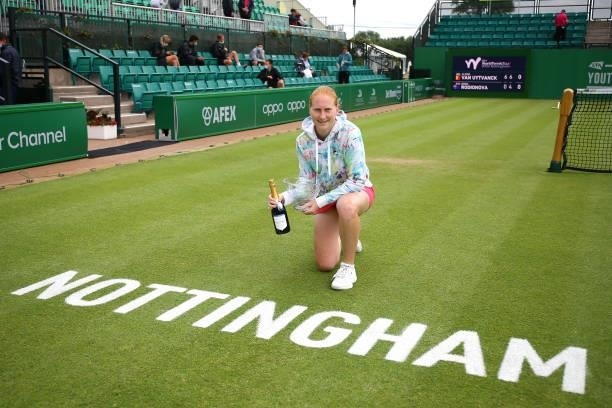 Alison Van Uytvanck of Belgium poses after winning the Finals match against Arina Rodionova of Australia during the ITF W100 Final of the Nottingham...
