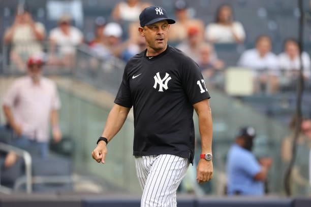 Manager Aaron Boone of the New York Yankees walks off the field after being ejected by home plate umpire Sean Barber during ninth inning of a game at...