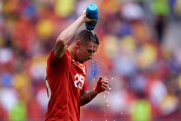 Darko Churlinov of North Macedonia pours water on his head during the UEFA Euro 2020 Championship Group C match between Ukraine and North Macedonia...