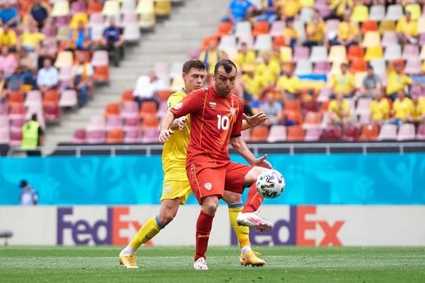 Goran Pandev of North Macedonia battles for possession with Mykola Matviyenko of Ukraine during the UEFA Euro 2020 Championship Group C match between...