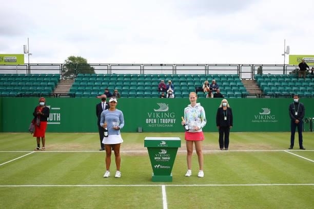 Alison Van Uytvanck of Belgium and Arina Rodionova of Australia pose for their trophy photo along with the presentation party during the ITF W100...