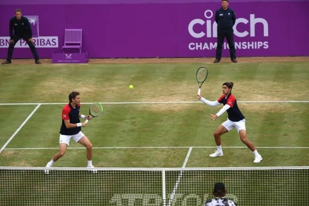 Pierre-Hugues Herbert of France, playing partner of Nicolas Mahut of France plays a forehand during the finals against Reilly Opelka of USA and \John...