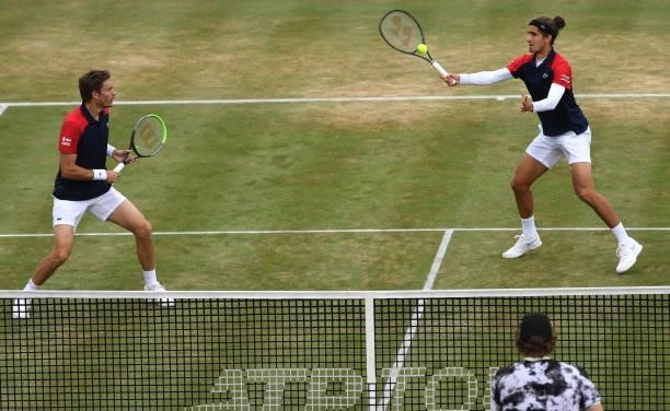 Pierre-Hugues Herbert of France, playing partner of Nicolas Mahut of France plays a forehand during the finals against Reilly Opelka of USA and \John...