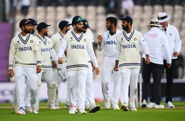 Virat Kohli of India leads his side off as play is abandoned due to bad light on Day 3 of the ICC World Test Championship Final between India and New...