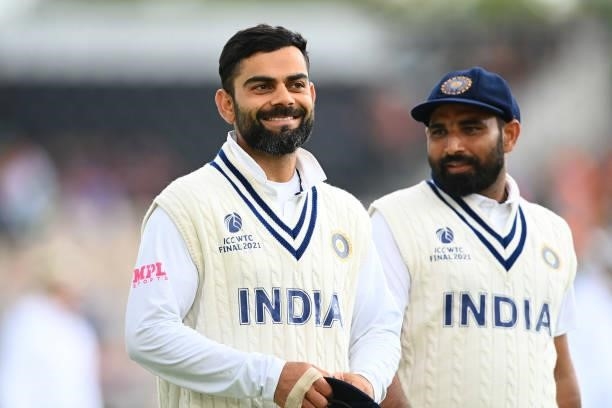 Virat Kohli of India leads his side off as play is abandoned due to bad light on Day 3 of the ICC World Test Championship Final between India and New...