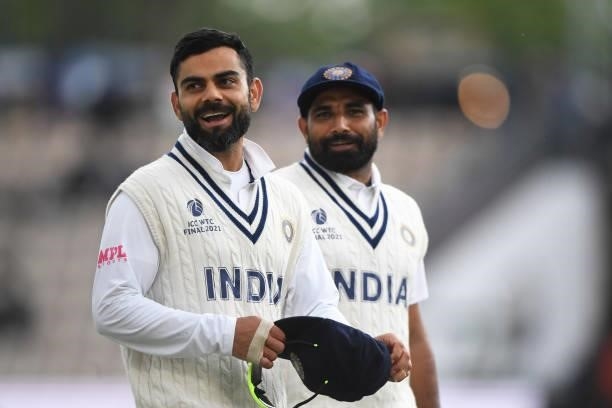 Virat Kohli of India leads his team off the field after bad light stops play during Day 3 of the ICC World Test Championship Final between India and...
