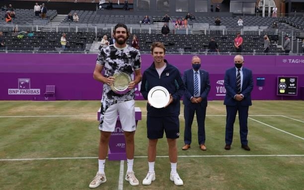 Reilly Opelka of USA and John Peers of Australia during the trophy presentation after finishing second in the mens doubles finals during Day 7 of The...