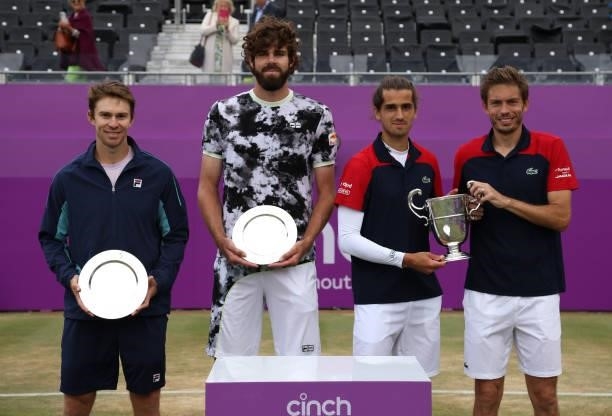 Reilly Opelka of USA, John Peers of Australia, Pierre-Hugues Herbert of France and Nicolas Mahut of France during the trophy presentation after the...
