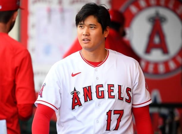 Shohei Ohtani of the Los Angeles Angels looks on from the dugout during the game against the Detroit Tigers at Angel Stadium of Anaheim on June 18,...