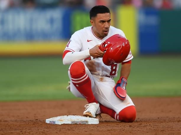 Kean Wong of the Los Angeles Angels sits on the bag after he was tagged out attempting to steal second base during the game against the Detroit...