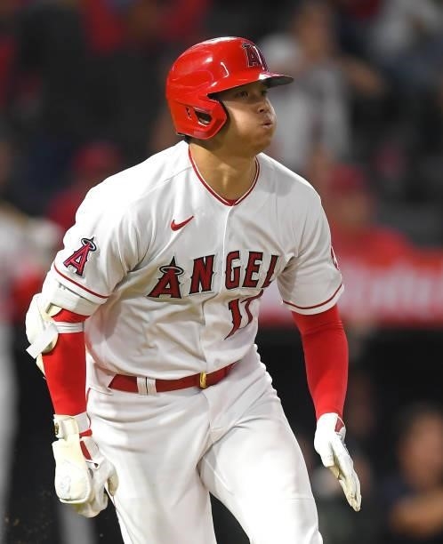 Shohei Ohtani of the Los Angeles Angels watches the ball clear the wall on a two run home run in the fifth inning of the game against the Detroit...