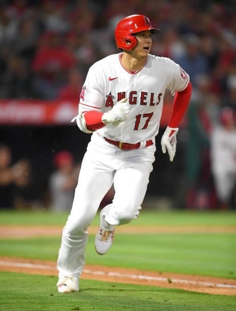 Shohei Ohtani of the Los Angeles Angels watches the ball clear the wall on a two run home run in the fifth inning of the game against the Detroit...