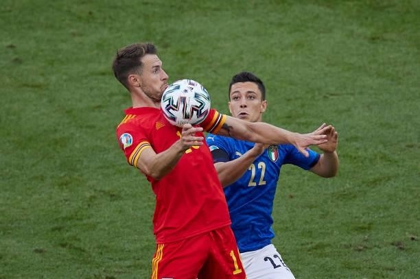 Aaron Ramsey of Wales competes for the ball with Giacomo Raspadori of Italy during the UEFA Euro 2020 Championship Group A match between Italy and...