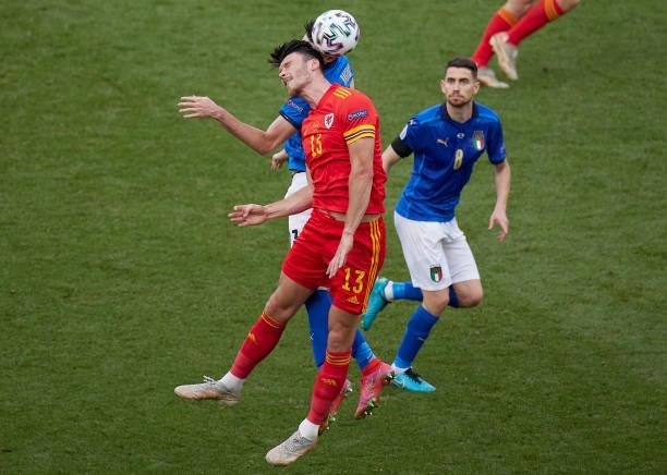 Kieffer Moore of Wales battle for the ball during the UEFA Euro 2020 Championship Group A match between Italy and Wales at Olimpico Stadium on June...