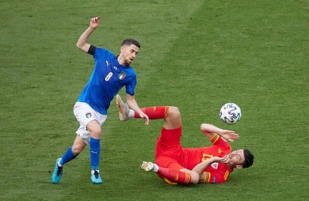 Jorginho of Italy competes for the ball with Kieffer Moore of Wales during the UEFA Euro 2020 Championship Group A match between Italy and Wales at...