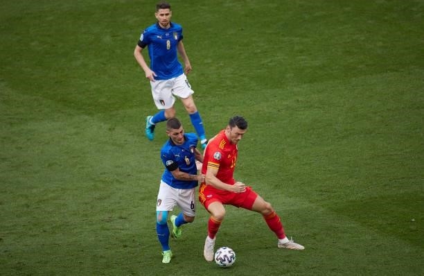 Marco Verratti of Italy competes for the ball with Kieffer Moore of Wales during the UEFA Euro 2020 Championship Group A match between Italy and...