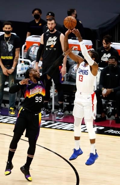 Paul George of the Los Angeles Clippers shoots against Jae Crowder of the Phoenix Suns in the first quarter during game one of the Western Conference...