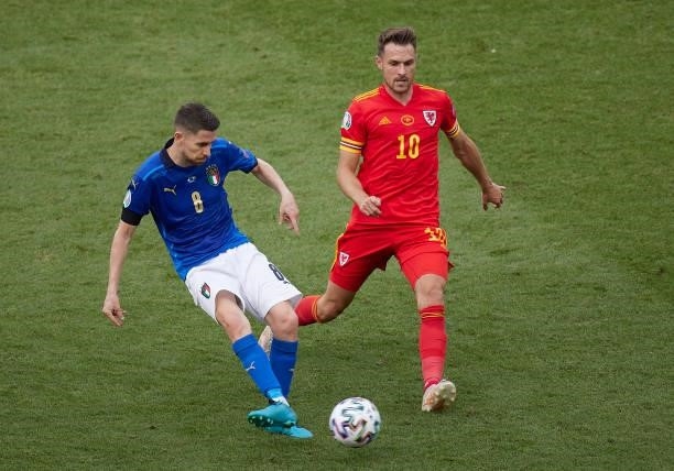 Jorginho of Italy competes for the ball with Aaron Ramsey of Wales during the UEFA Euro 2020 Championship Group A match between Italy and Wales at...