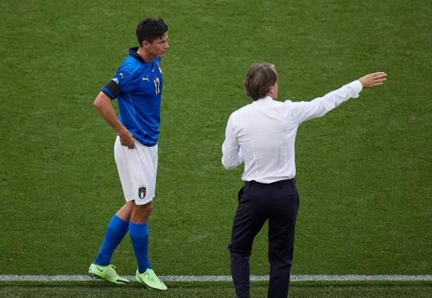 Matteo Pessina of Italy speaks with Roberto Mancini, Manager of Italy during the UEFA Euro 2020 Championship Group A match between Italy and Wales at...