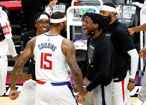 DeMarcus Cousins of the Los Angeles Clippers reacts with teammates in the first half against the Phoenix Suns during game one of the Western...