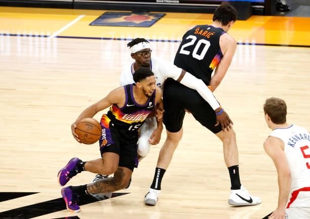 Cameron Payne of the Phoenix Suns handles the ball against Reggie Jackson of the Los Angeles Clippers in the first half during game one of the...