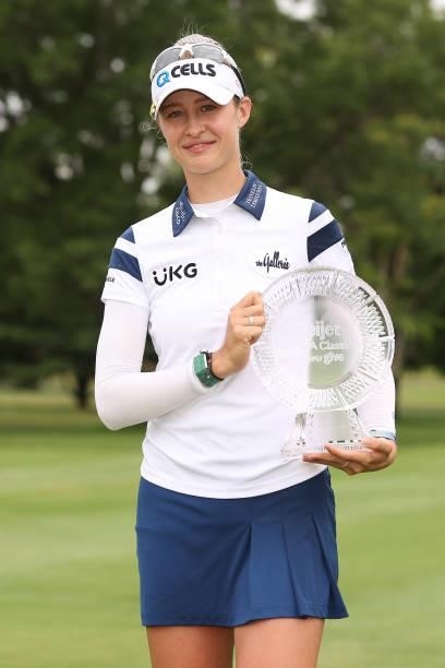 Nelly Korda poses with the trophy after winning the Meijer LPGA Classic for Simply Give at Blythefield Country Club on June 20, 2021 in Grand Rapids,...