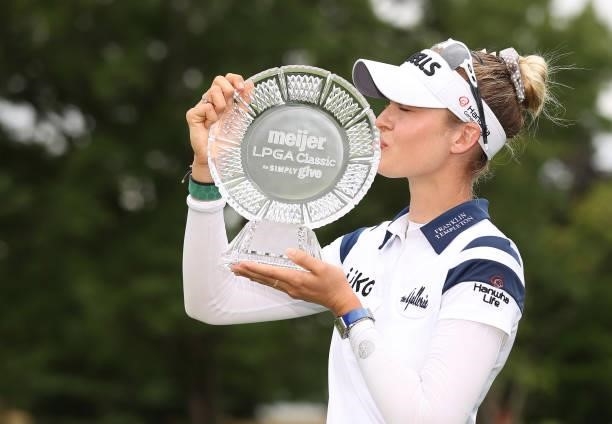 Nelly Korda kisses the trophy after winning the Meijer LPGA Classic for Simply Give at Blythefield Country Club on June 20, 2021 in Grand Rapids,...
