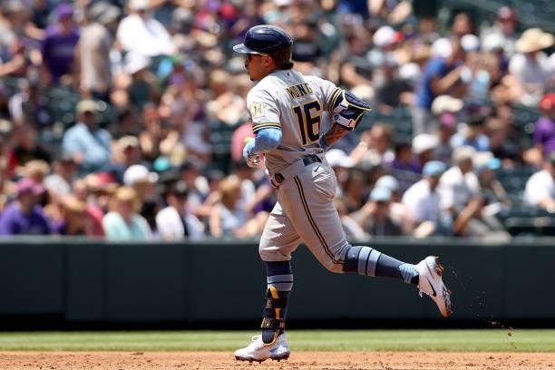 Kolten Wong of the Milwaukee Brewers circle the bases after hitting a 2 RBI home run against the Colorado Rockies in the second inning at Coors Field...