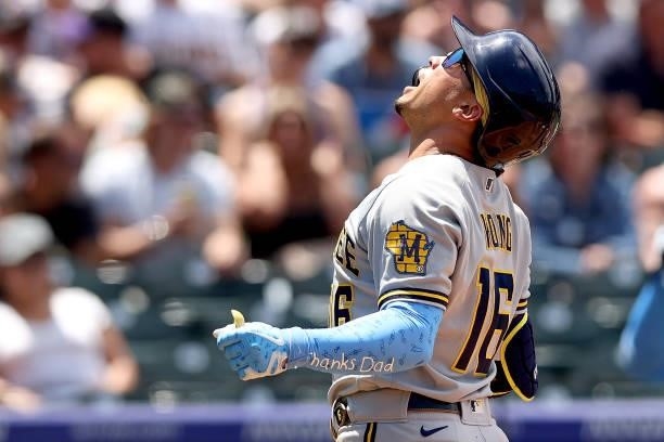 Kolten Wong of the Milwaukee Brewers celebrates after crossing home plate after hitting a 2 RBI home run against the Colorado Rockies in the second...