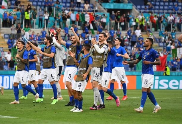 Players of Italy celebrate at the end of the UEFA Euro 2020 Championship Group A match between Italy and Wales at Olimpico Stadium on June 20, 2021...