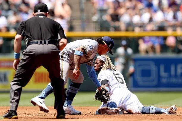 Raimel Tapia of the Colorado Rockies steals second base against Kolten Wong of the Milwaukee Brewers in the first inning at Coors Field on June 20,...