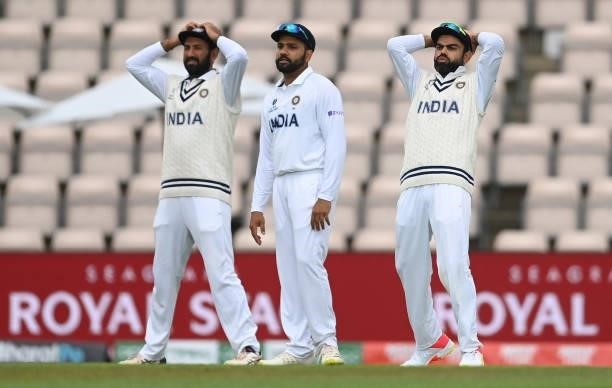 Cheteshwar Pujara, Rohit Sharma and Virat Kohli of India react during Day 3 of the ICC World Test Championship Final between India and New Zealand at...