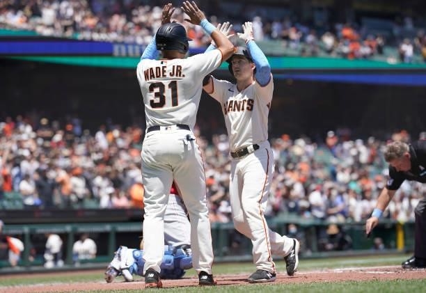 Mike Yastrzemski and LaMonte Wade Jr of the San Francisco Giants celebrates after Yastrzemski hit a two-run home run against the Philadelphia...