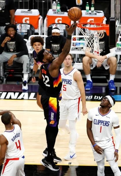 Deandre Ayton of the Phoenix Suns drives to the basket against Reggie Jackson of the Los Angeles Clippers in the second quarter during game one of...