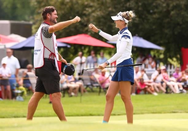 Nelly Korda and her caddie Jason McDede celebrate winning the Meijer LPGA Classic for Simply Give at Blythefield Country Club on June 20, 2021 in...